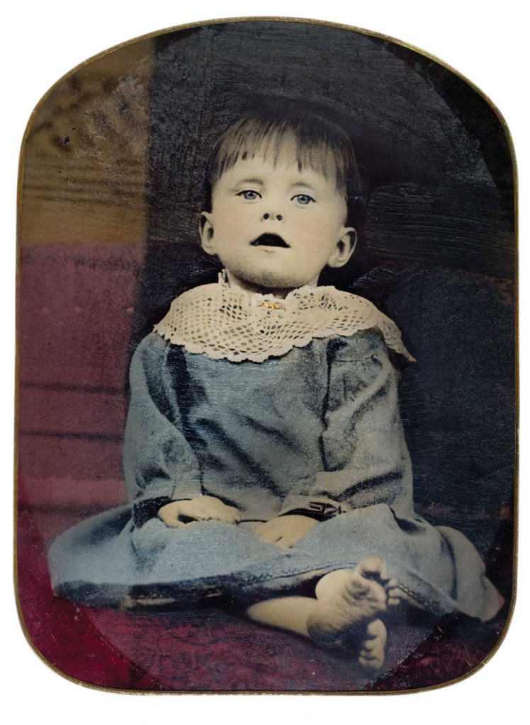This child’s eyes are hand-painted open on tintype, circa 1870. Image via Burns Archive via HIstory.com